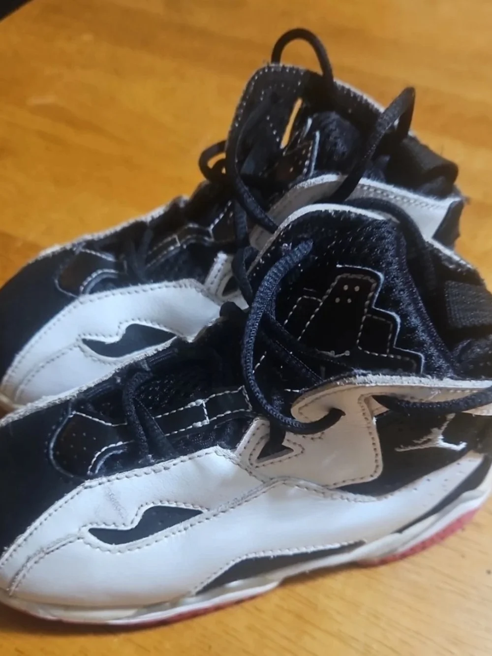 Jordan Kids Black and White High-Top Sneakers
